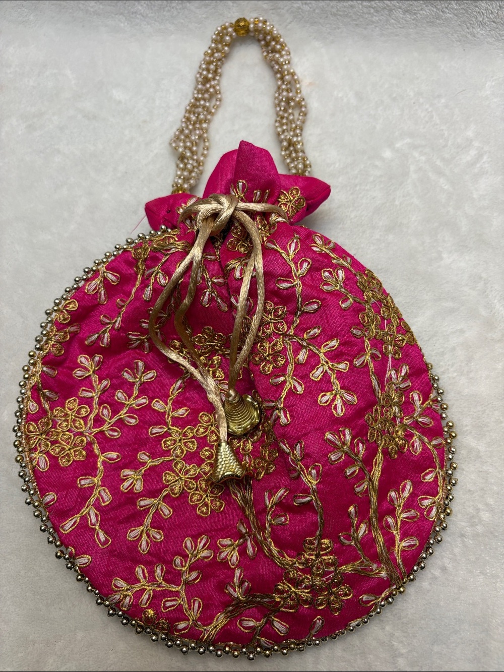 Hand-Embroidered Pink Potli Bag with Gold Thread Detailing